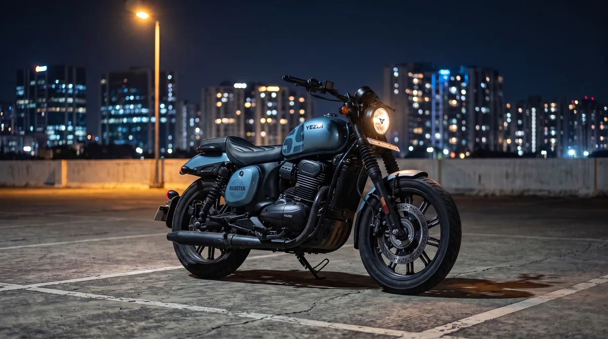 A Sharkskin Blue Yezdi Roadster parked on a rooftop car park deck at night, city lights behind.