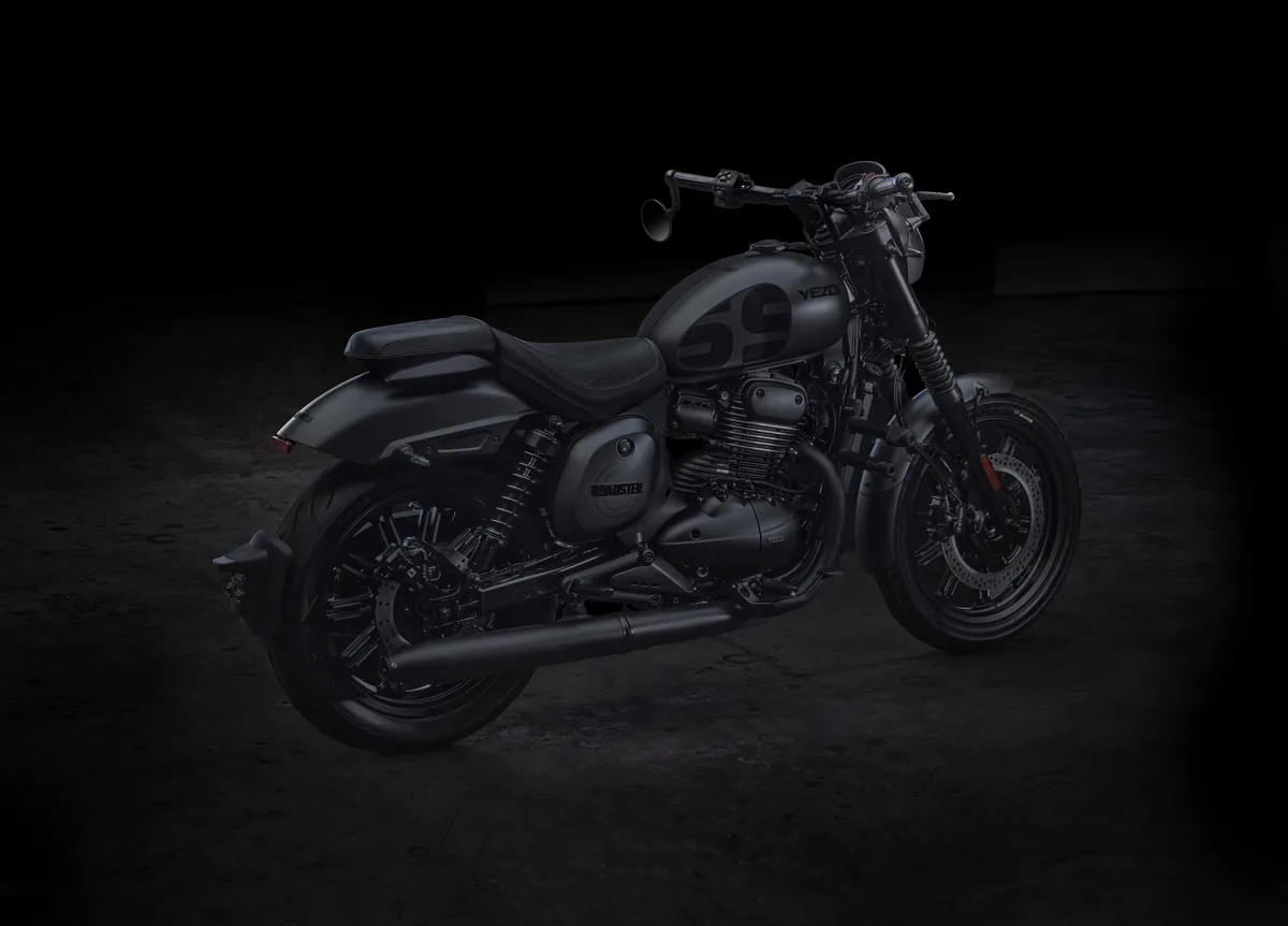 Yezdi Roadster in a matte grey finish, rear three-quarter view in a dark studio.