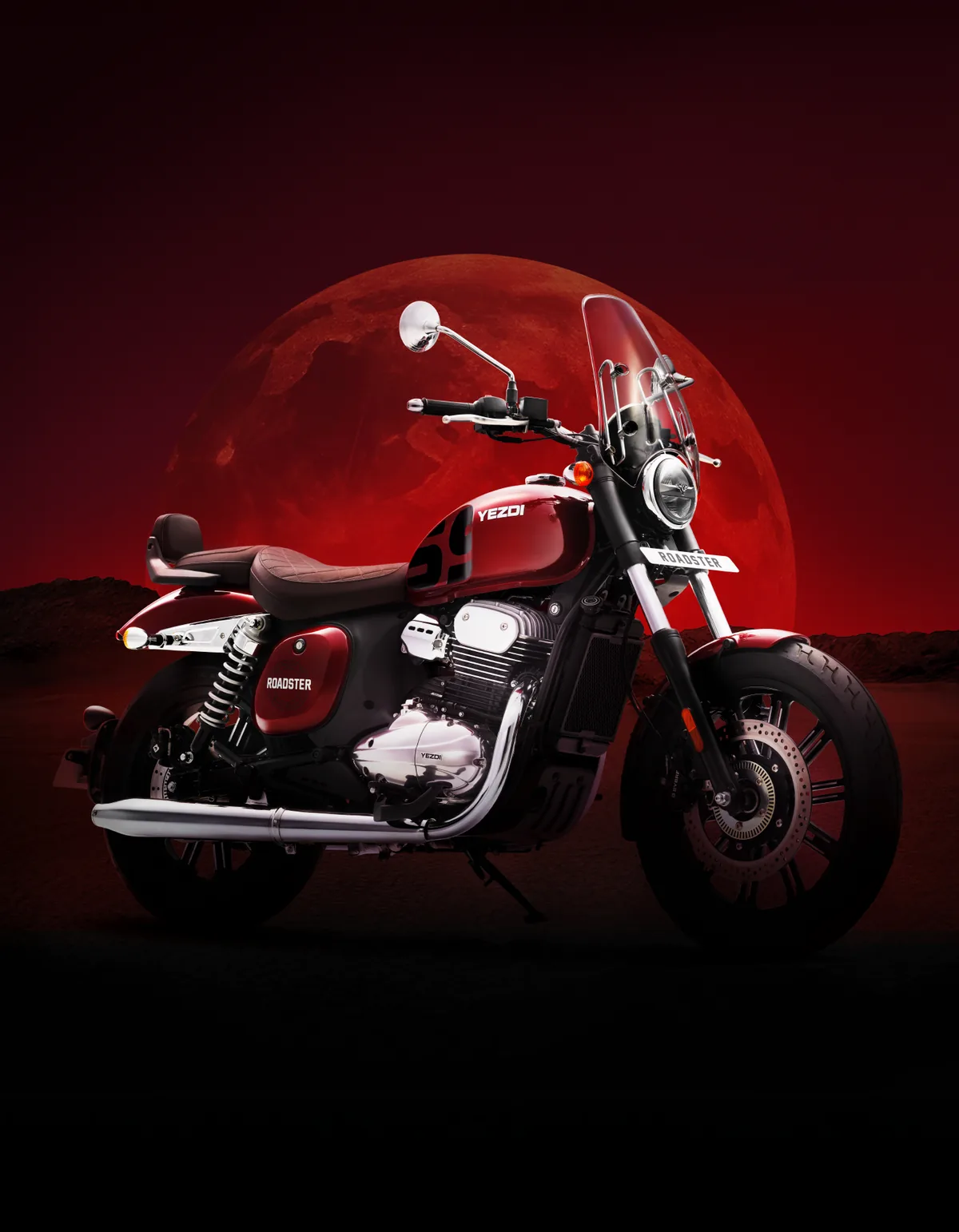 Yezdi Roadster in Red Wolf, front three-quarter view against a red moon.